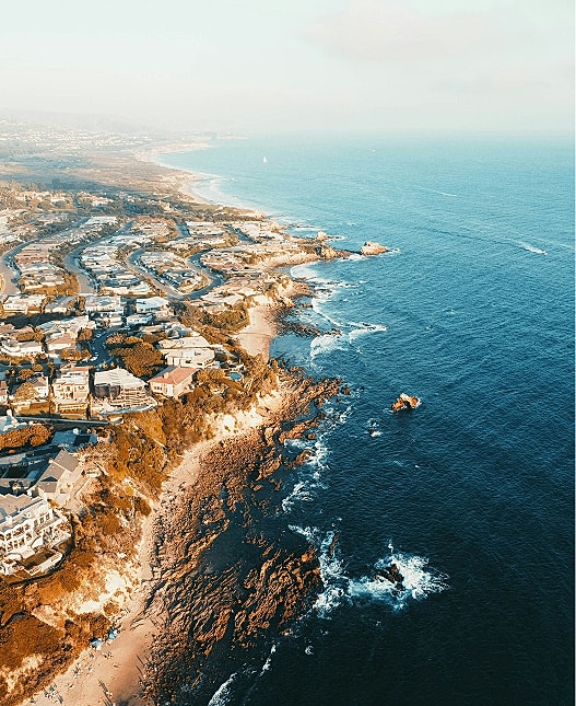 Coastal view of ocean and residential area.
