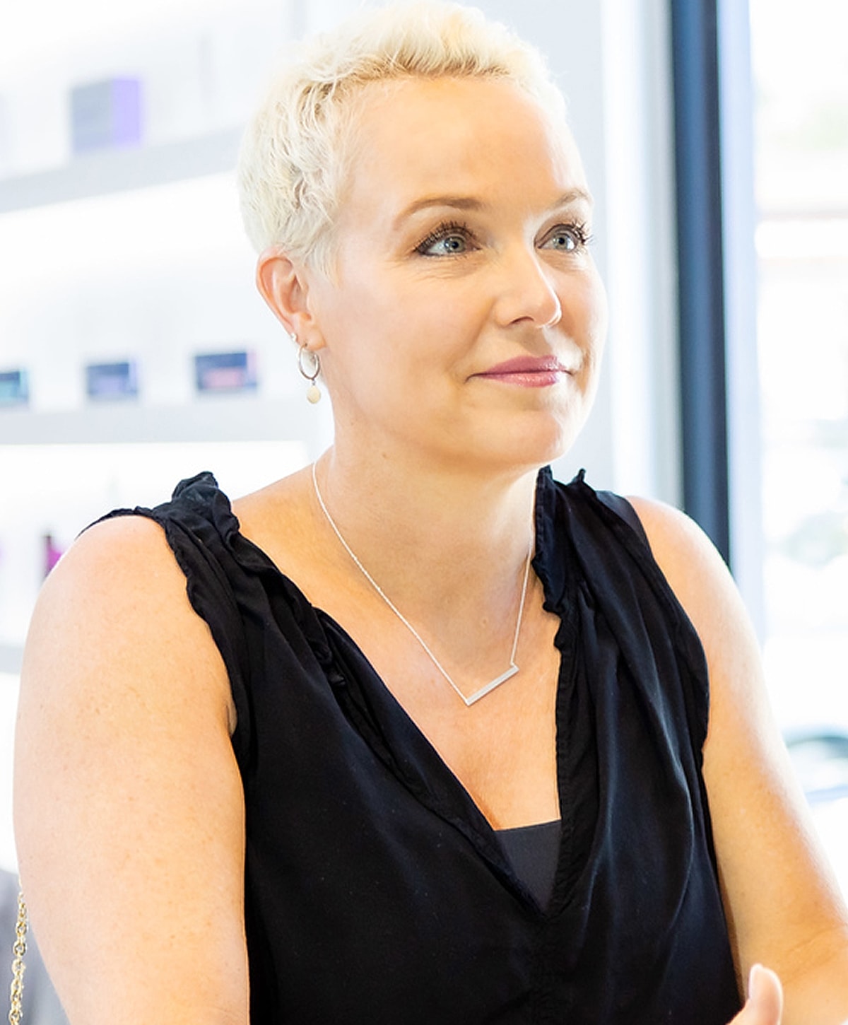 Close-up of a woman's face and smile.