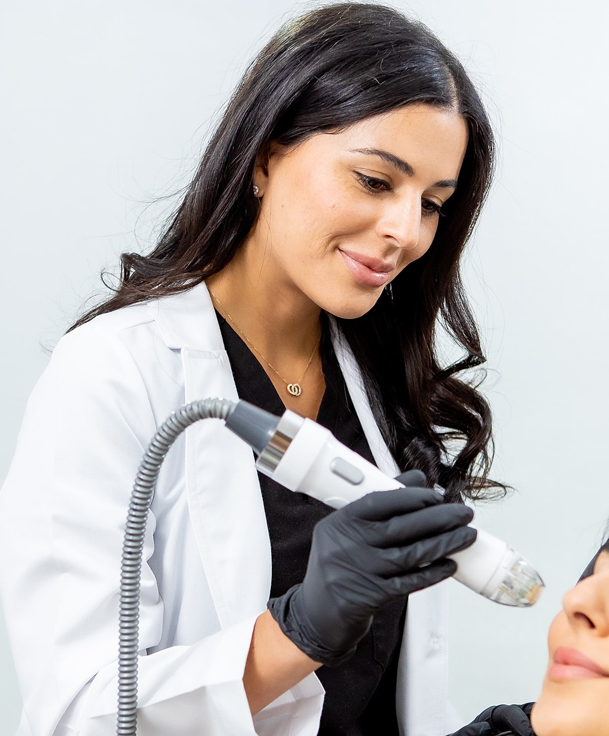 Medical professional performing skin treatment procedure.