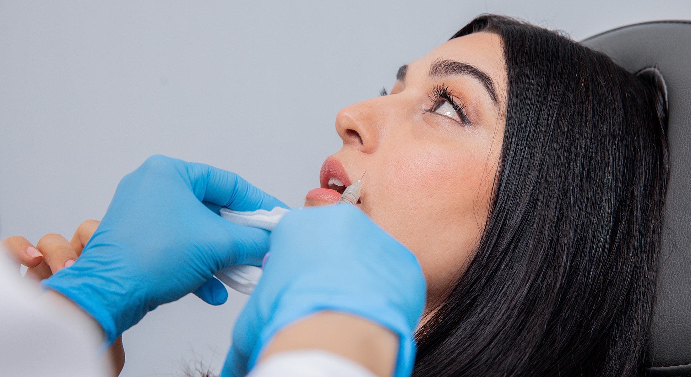 Dysport patient receiving cosmetic lip treatment in clinic.