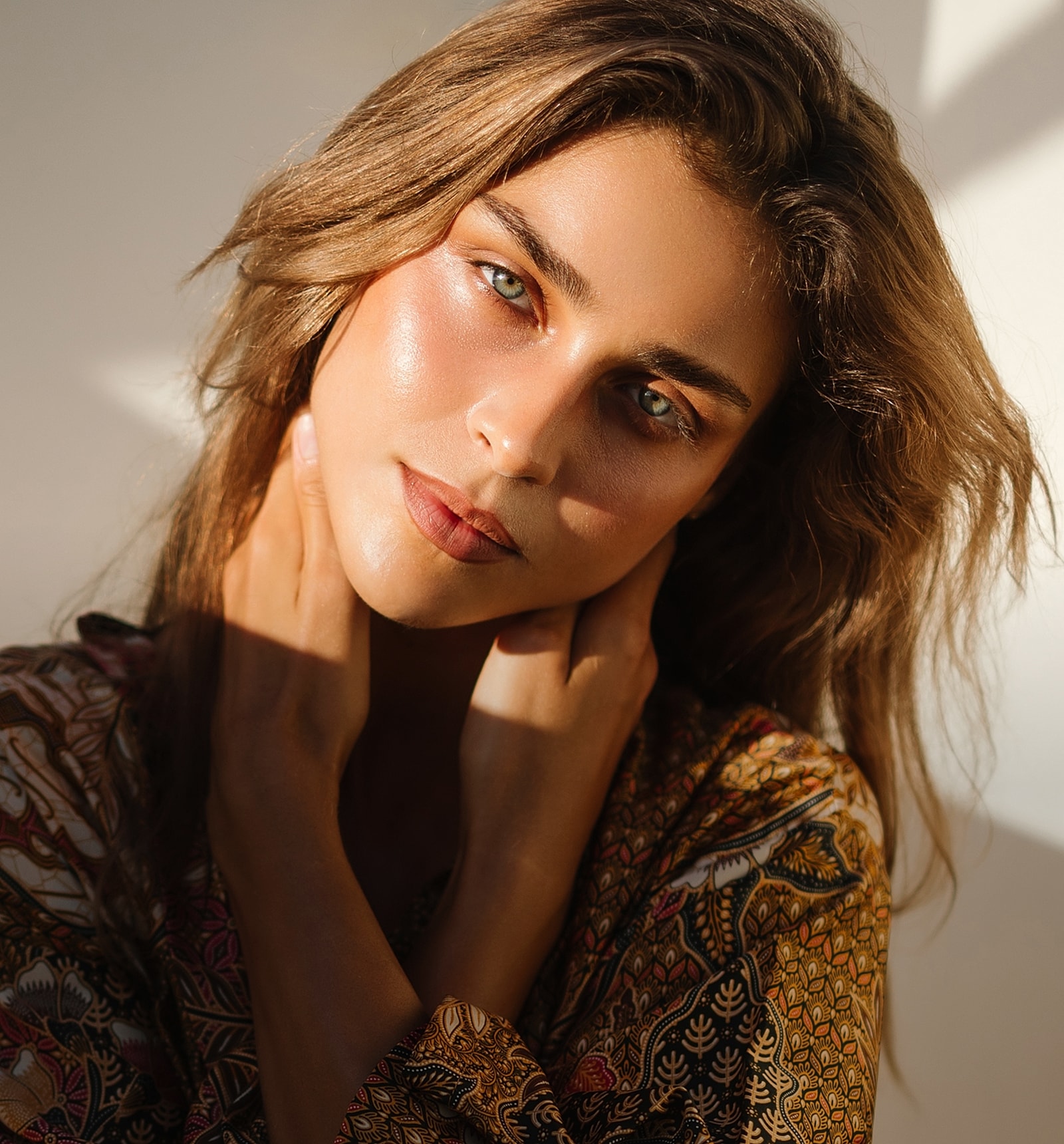 Portrait of a woman with glowing skin.